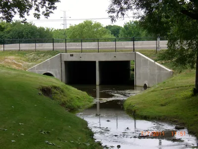 Triple-barrel reinforced concrete box culvert beneath a roadway