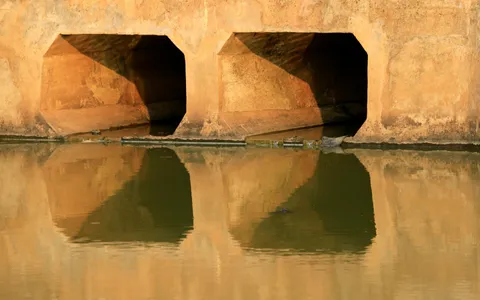 Aerial drone view of a waterway channel and drainage infrastructure